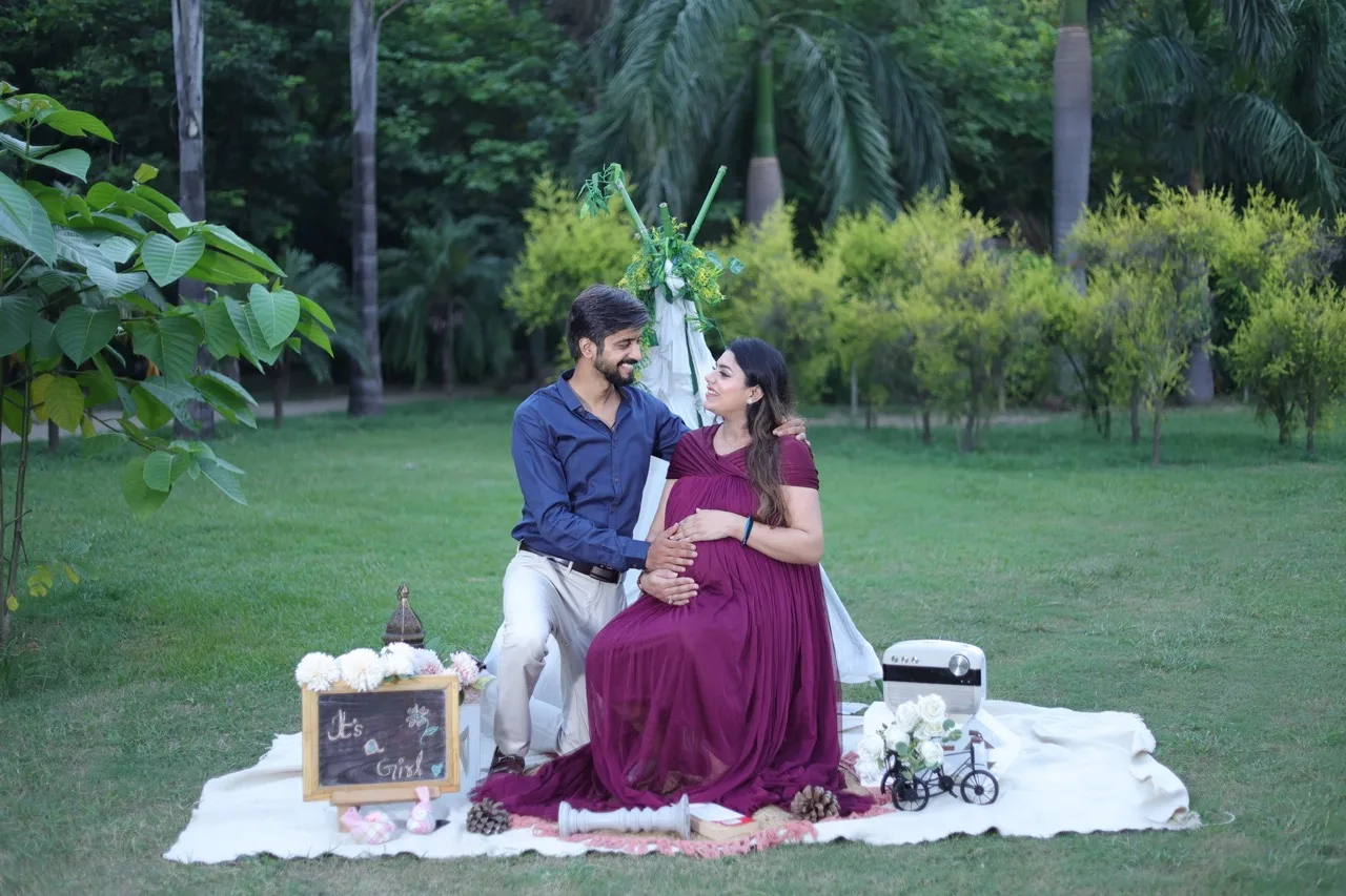 Close-up maternity portrait of expectant mother in a maroon dress