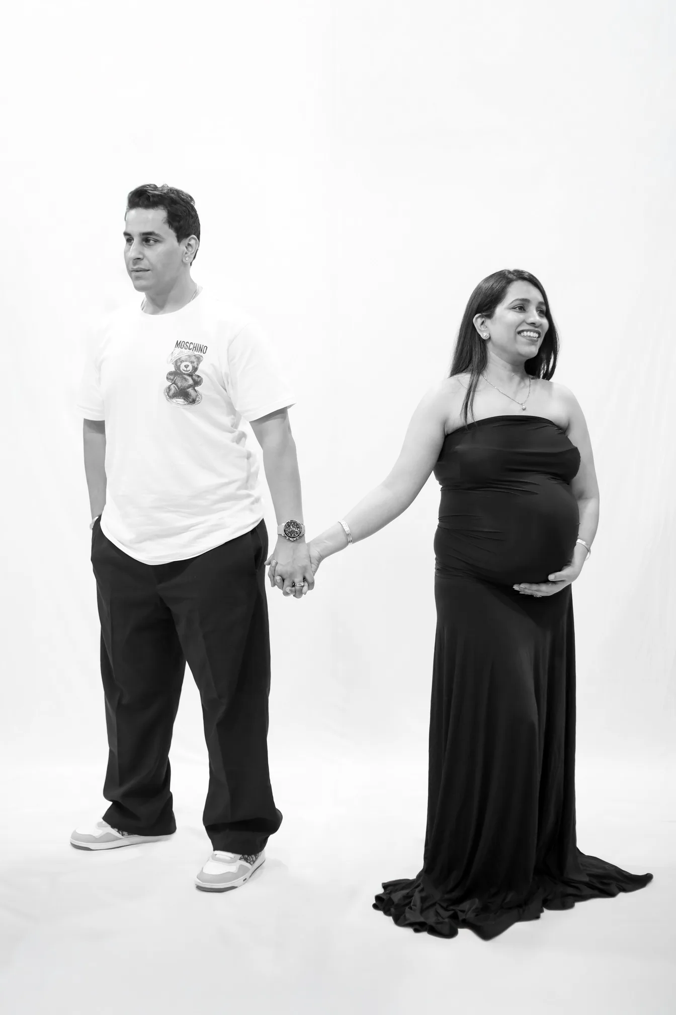 Black and white couple maternity portrait with husband and wife for a magazine cover look