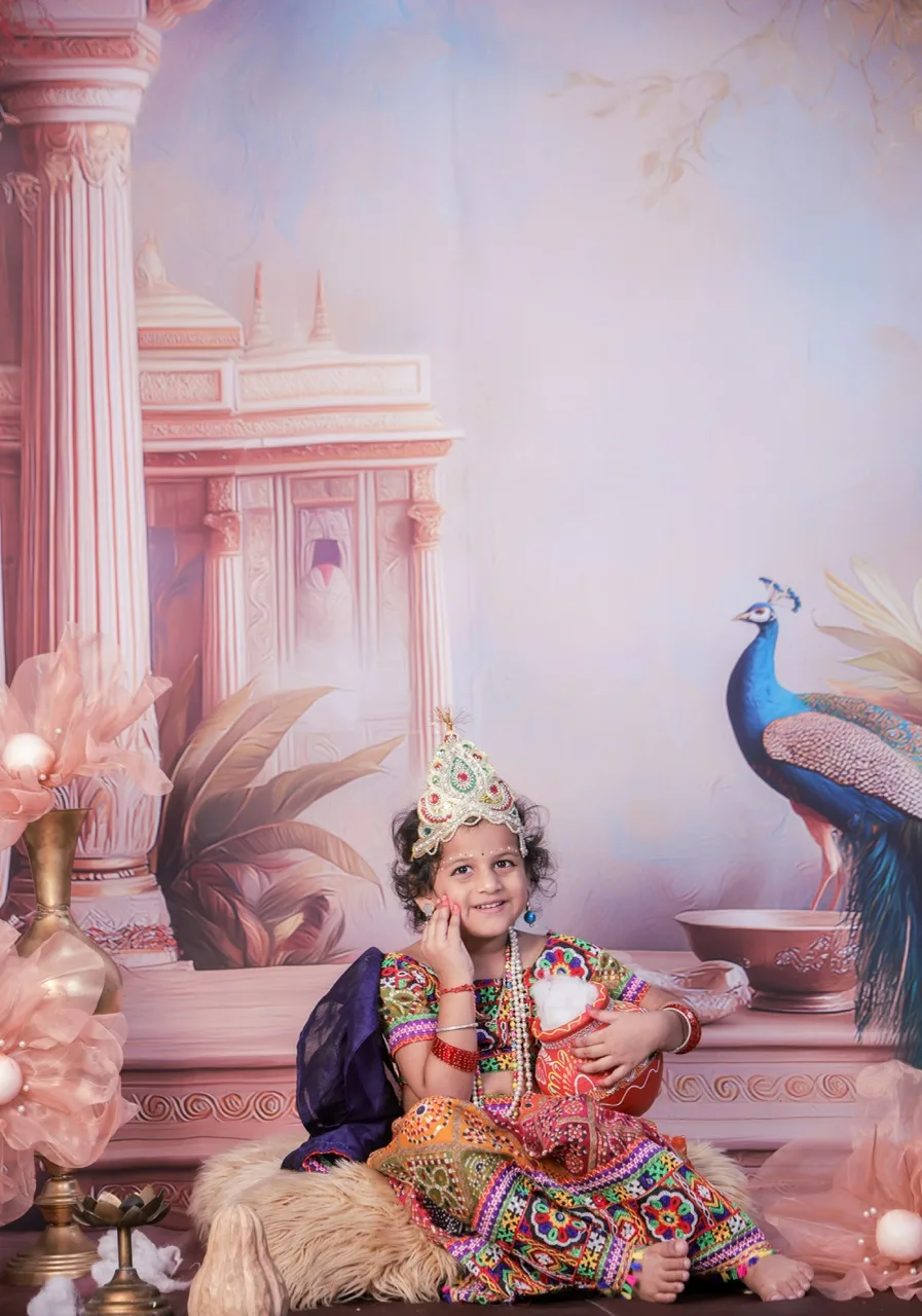 Baby girl in Radha dress with butter pot for Aangan theme photoshoot in Delhi, Janmashtami Krishna theme baby photoshoot in Delhi NCR.