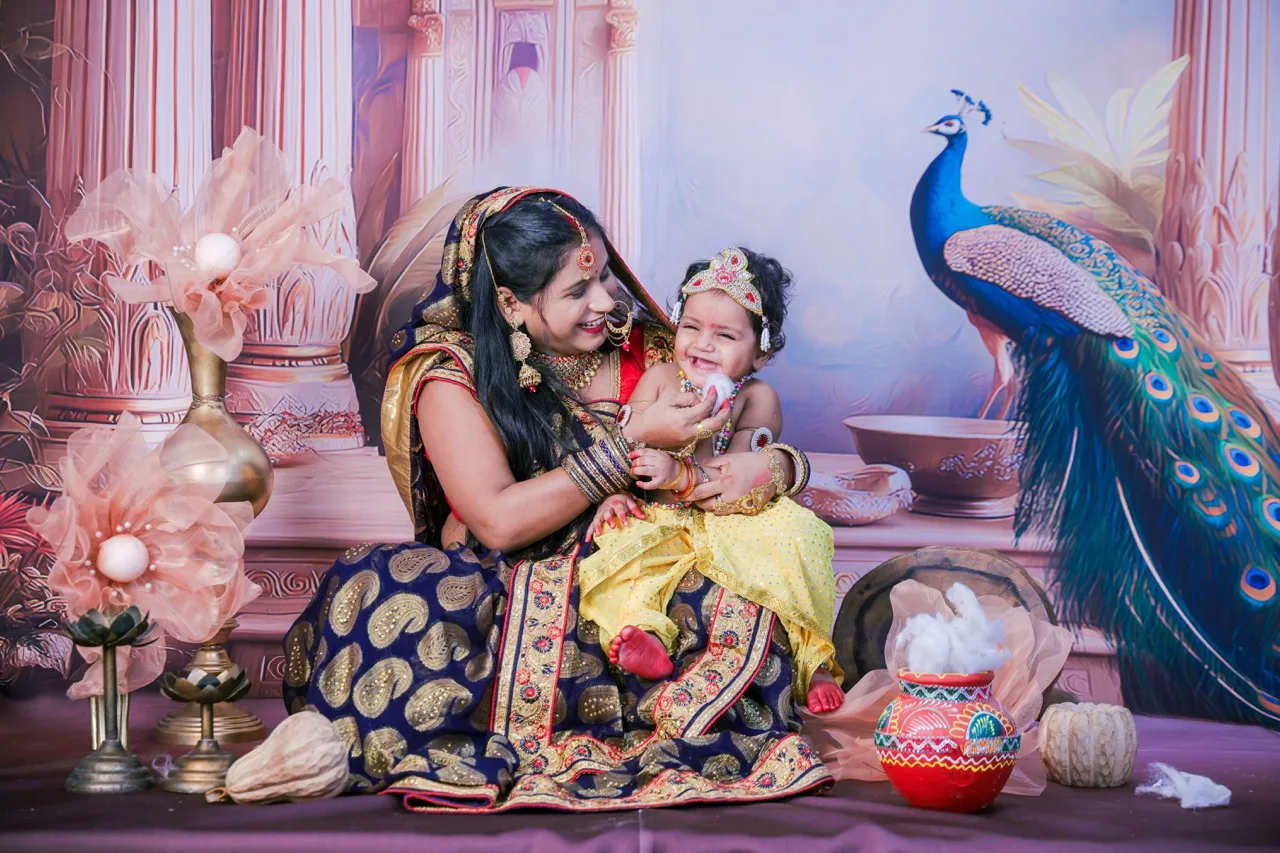Yashoda ma playing with baby Krishna during a family photoshoot, Janmashtami Krishna theme baby photoshoot in Delhi NCR.