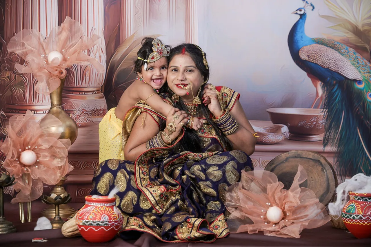 An adorable baby Krishna leaning on Yashoda ma in a tender moment, Janmashtami Krishna theme baby photoshoot in Delhi NCR.