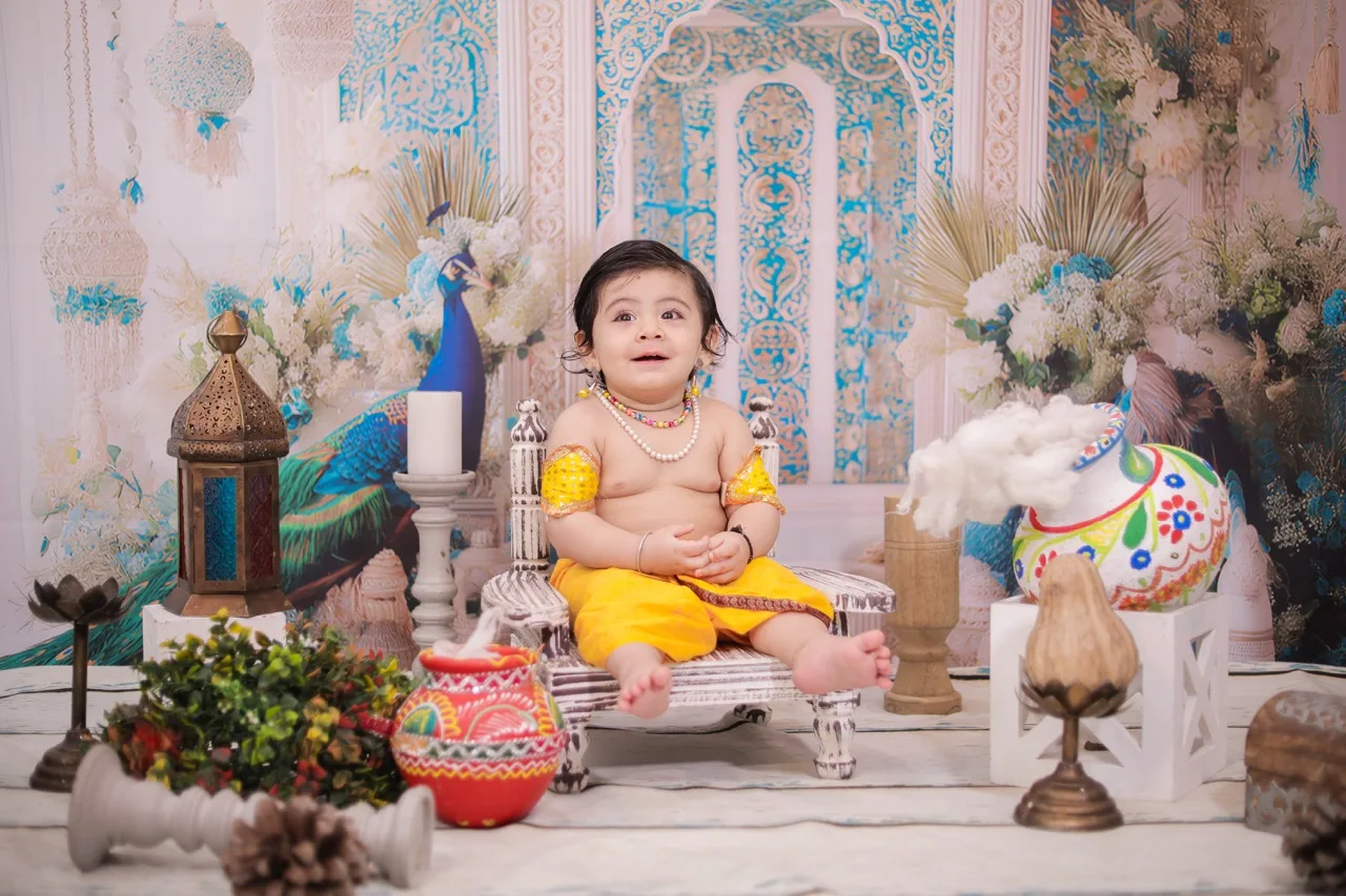Innocent baby boy in Krishna costume for Janmashtami photoshoot, Janmashtami Krishna theme baby photoshoot in Delhi NCR.
