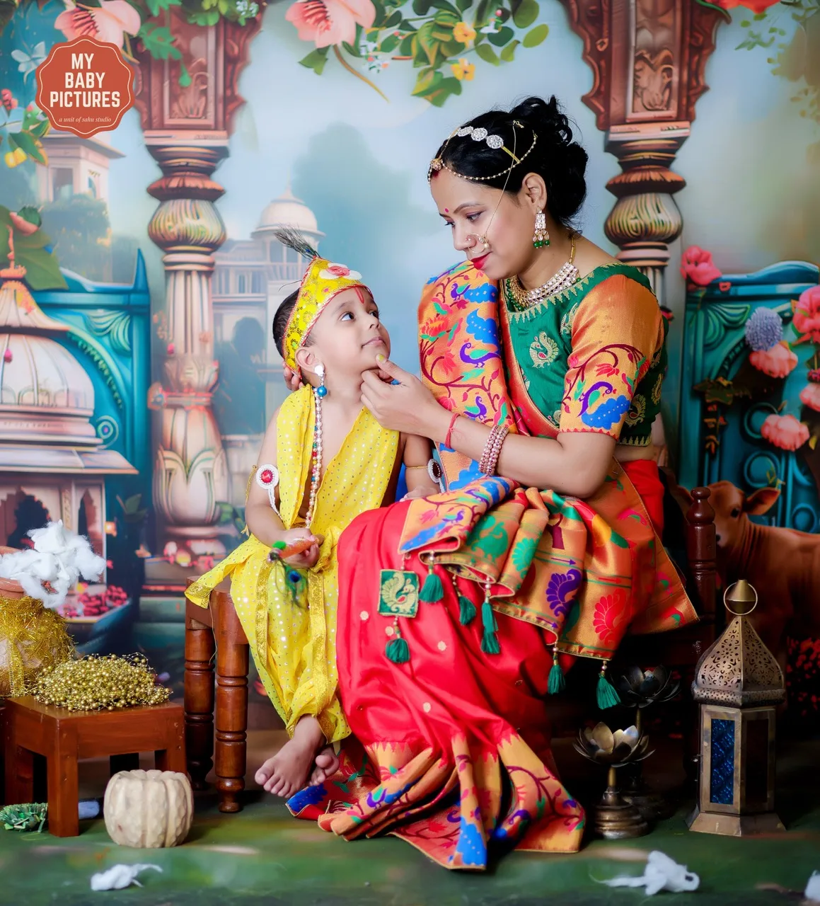 Baby Krishna looking up at Yashoda ma in a beautiful Gokul photoshoot setting, Janmashtami Krishna theme baby photoshoot in Delhi NCR.