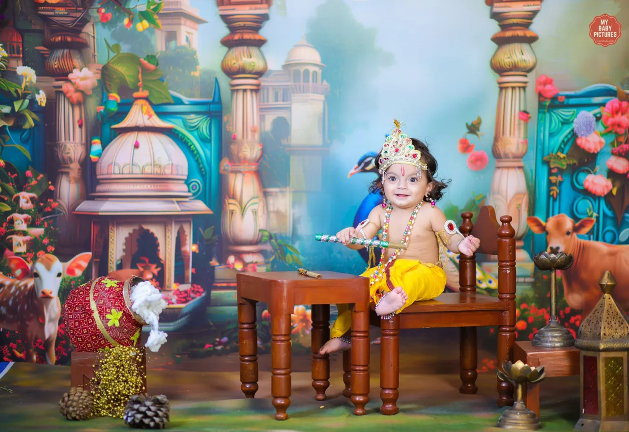 Baby boy as Krishna sitting on a small table for a photoshoot, Janmashtami Krishna theme baby photoshoot in Delhi NCR.