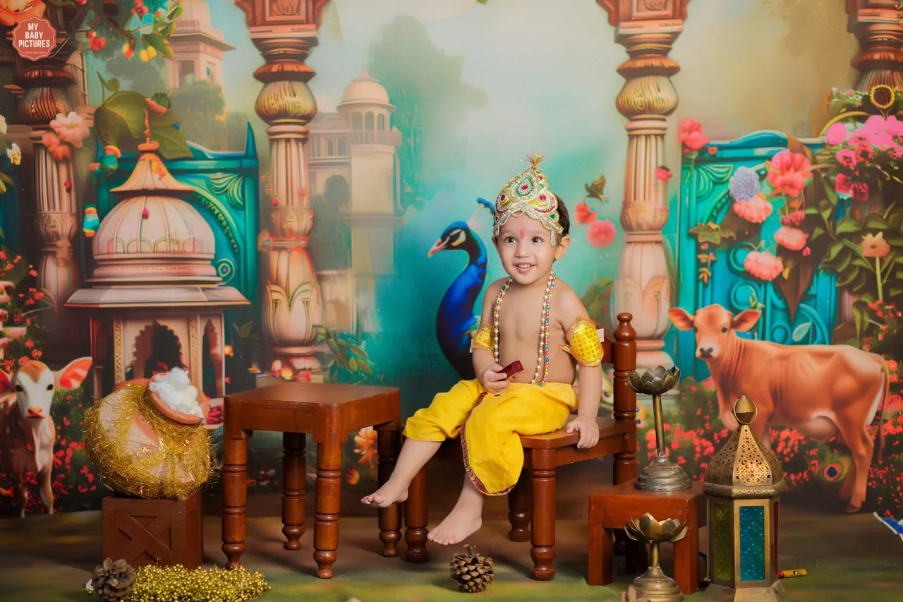 A joyful toddler boy as Krishna poses for his Janmashtami photoshoot, Janmashtami Krishna theme baby photoshoot in Delhi NCR.
