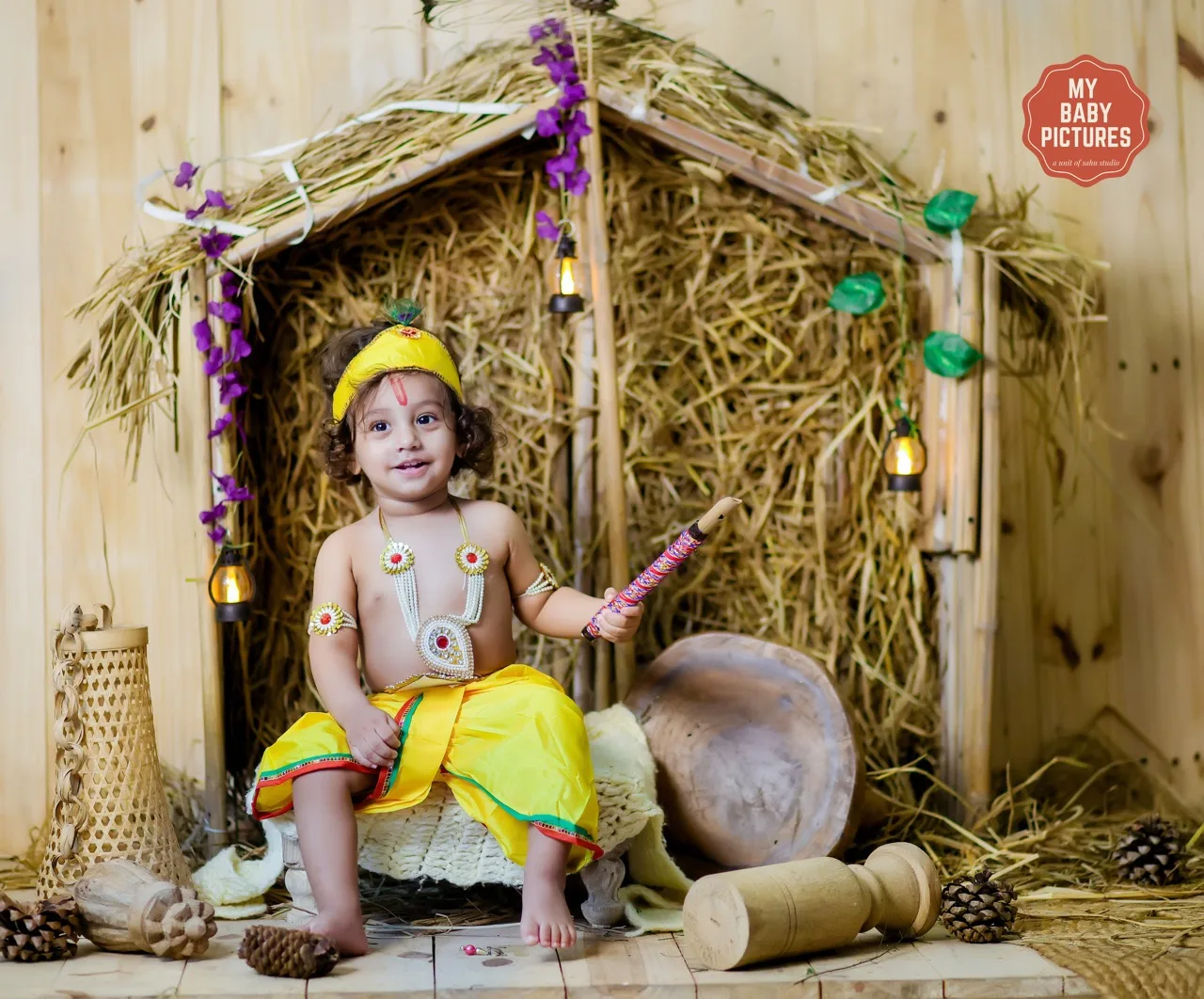 Baby boy photoshoot in a rustic hut (Kutiya) theme as Krishna, Janmashtami Krishna theme baby photoshoot in Delhi NCR.