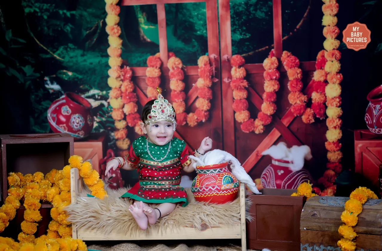 Baby photoshoot for Janmashtami with a cute girl in Radha costume, Janmashtami Krishna theme baby photoshoot in Delhi NCR.