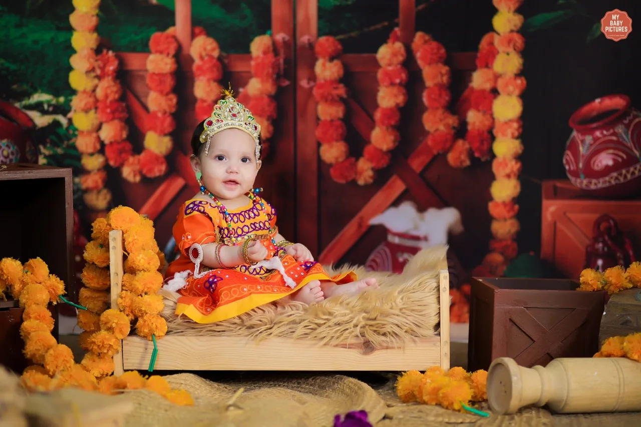 Close-up of a baby in a lovely dress for a Vrindavan theme photoshoot, Janmashtami Krishna theme baby photoshoot in Delhi NCR.