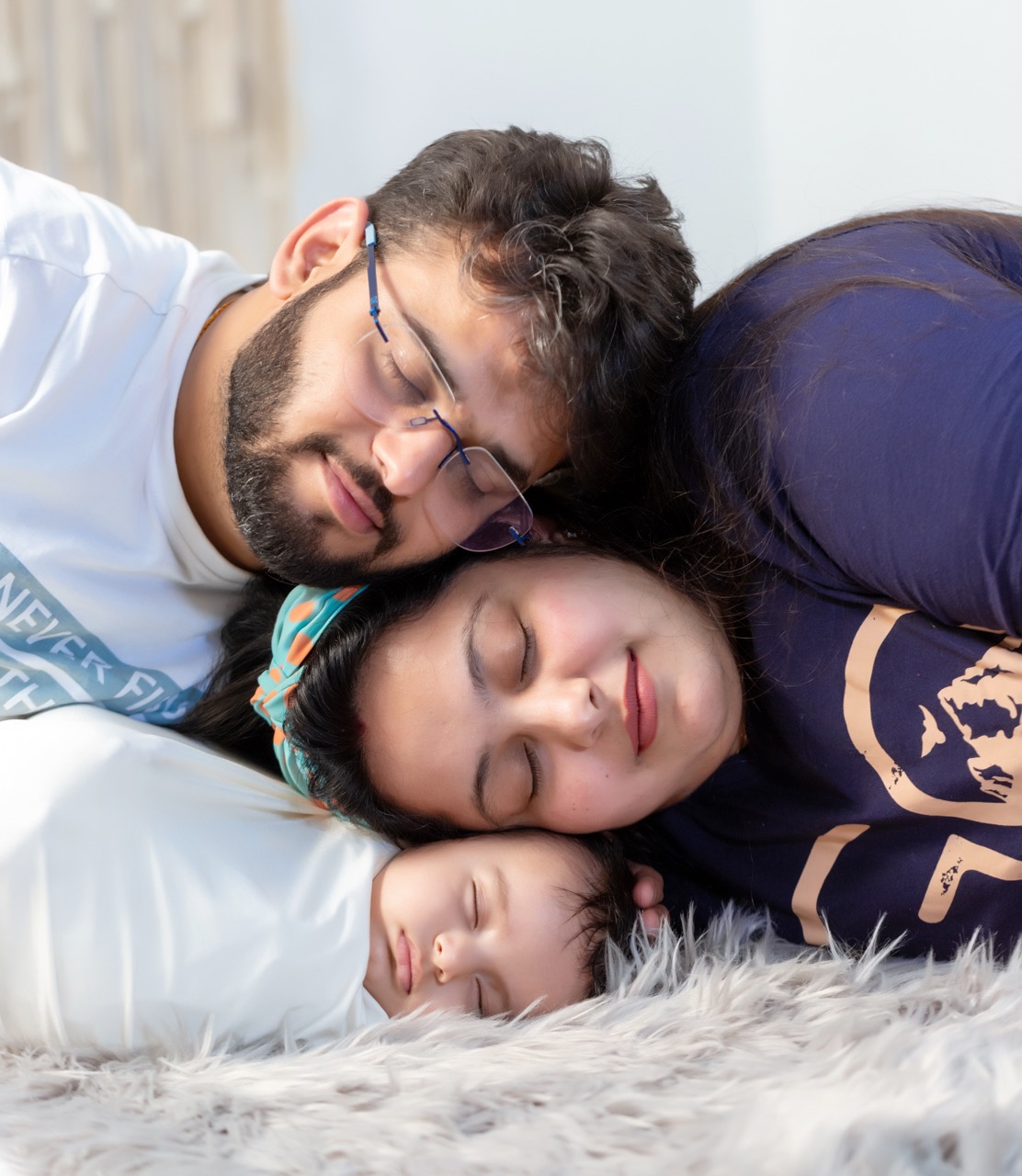Parents and baby close family portrait