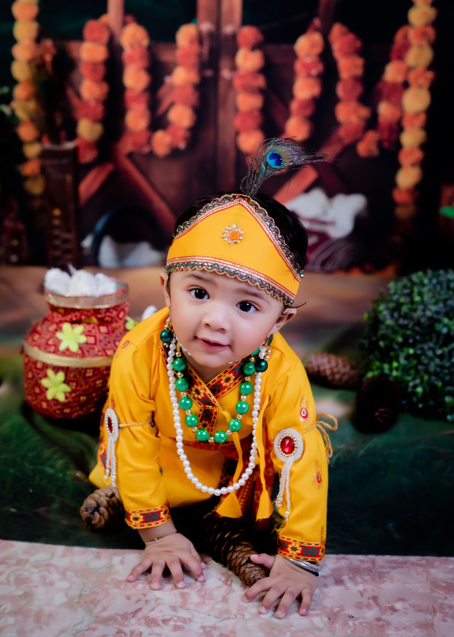 Toddler in Krishna outfit walking
